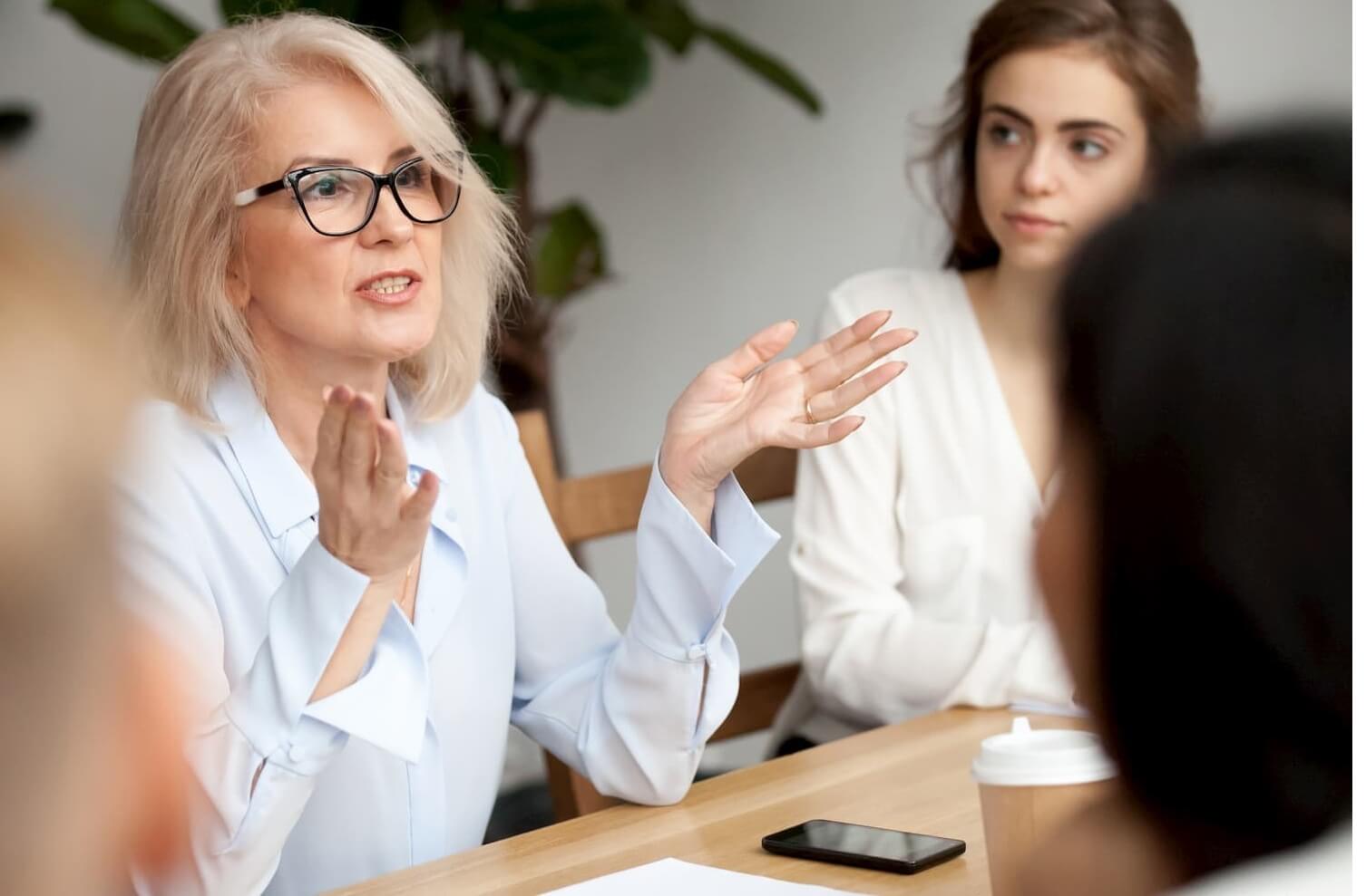 Female, senior executive leading a HR meeting on organisation values and strategy.